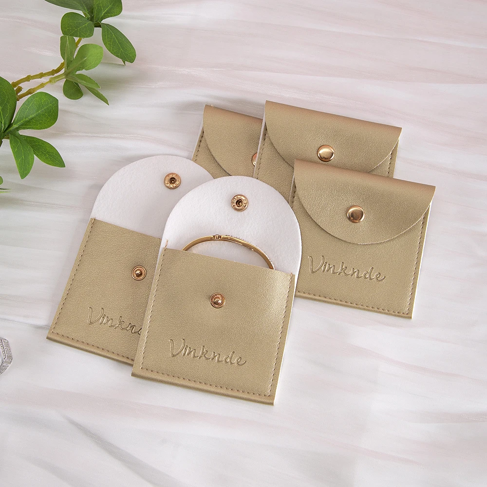 

Wholesale Gold PU Leather Jewelry Pouch Bag With Button Custom Wedding Travel Bracelet Ring Earrings Pouches With Logo Printed