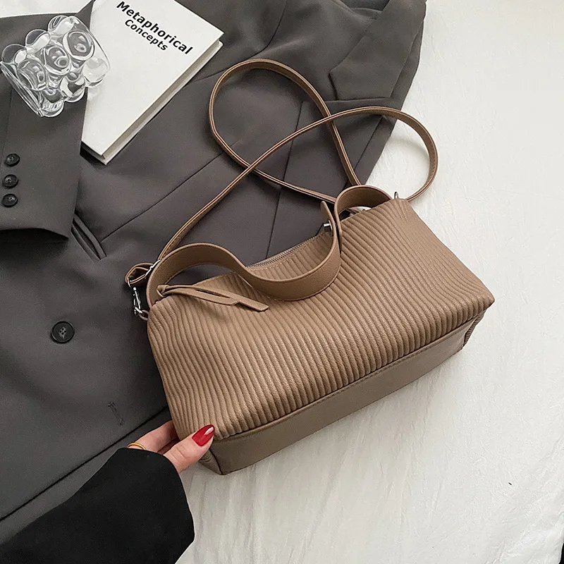 

Stand Out 2024 Tote. A uniquely designed spacious shoulder bag for the fashion-forward commuter.