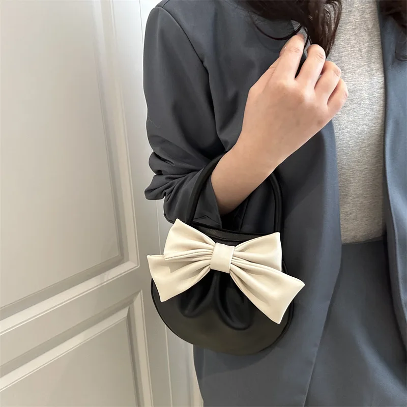 حقيبة ركاب بتصميم فاخر للنساء لربيع وصيف 2025 حقيبة يد أنيقة حقيبة سرج على شكل فيونكة للسيدات