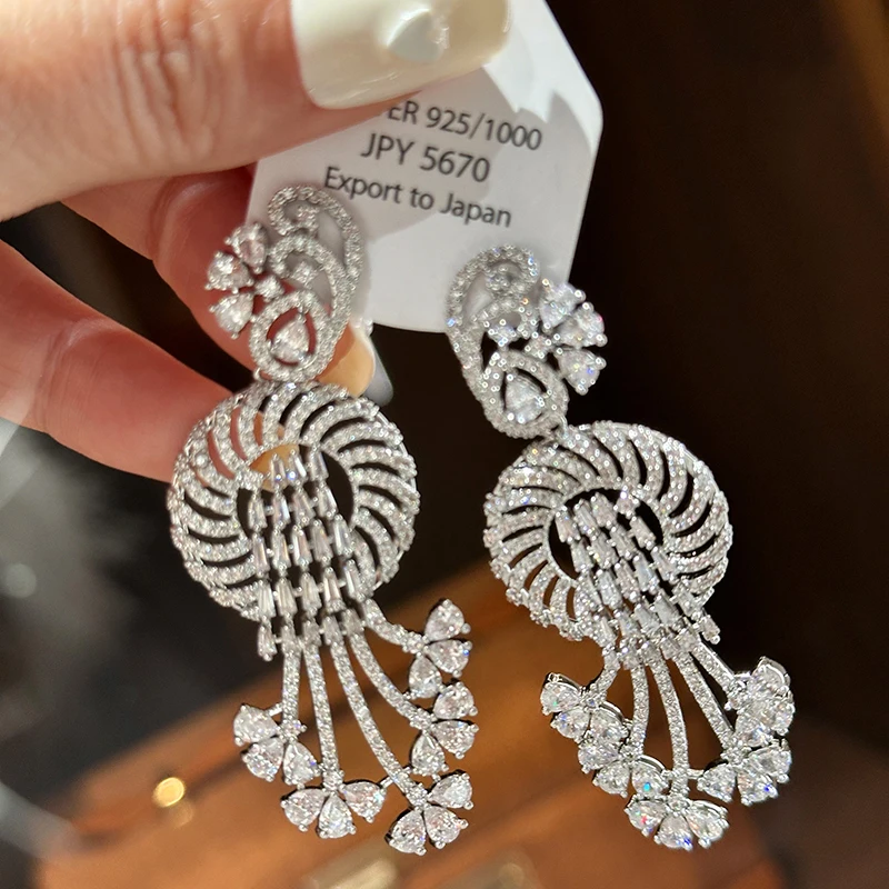 

Extravagant exaggerated dresses and party earrings accessories for women