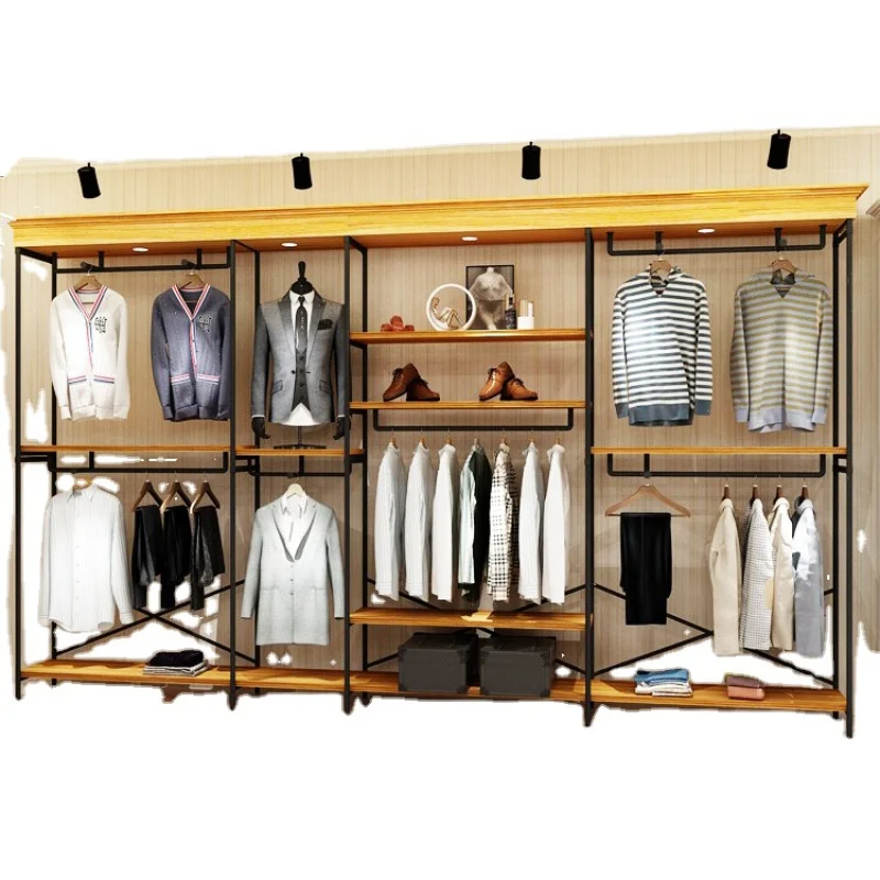 

Custom. Modern style golden stainless steel garment wall mounted clothing rack boutique clothes store standing display racks she