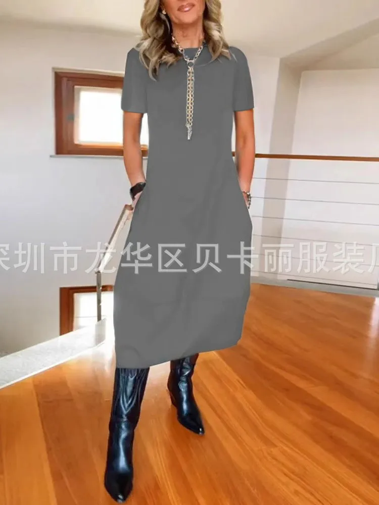 فستان نسائي صيفي جديد لعام 2025 فستان فضفاض غير رسمي بأكمام قصيرة ورقبة دائرية تي شيرت أنيق بلون واحد ملابس مكتب للسيدات