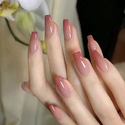 A full set of 24 medium coffin-shaped fake nails with a peachy gradient design, including 1 jelly glue and 1 nail file, perfect