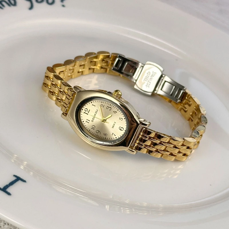 

Роскошные женские кварцевые часы с овальным циферблатом, золотым корпусом, стальным браслетом, простыми арабскими цифрами, элегантные наручные часы для женщин.