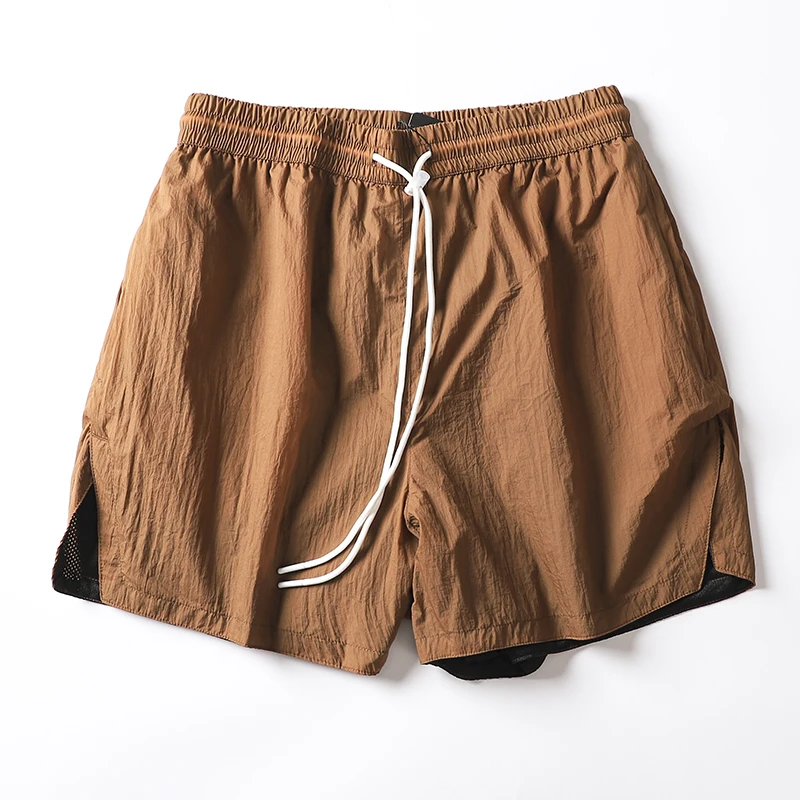 

Qui Dry Водонепроницаемые дышащие нейлоновые спортивные орты для бега для мужчин и женщин Футболка длиной четверти Повседневная свободная посадка Летние орты