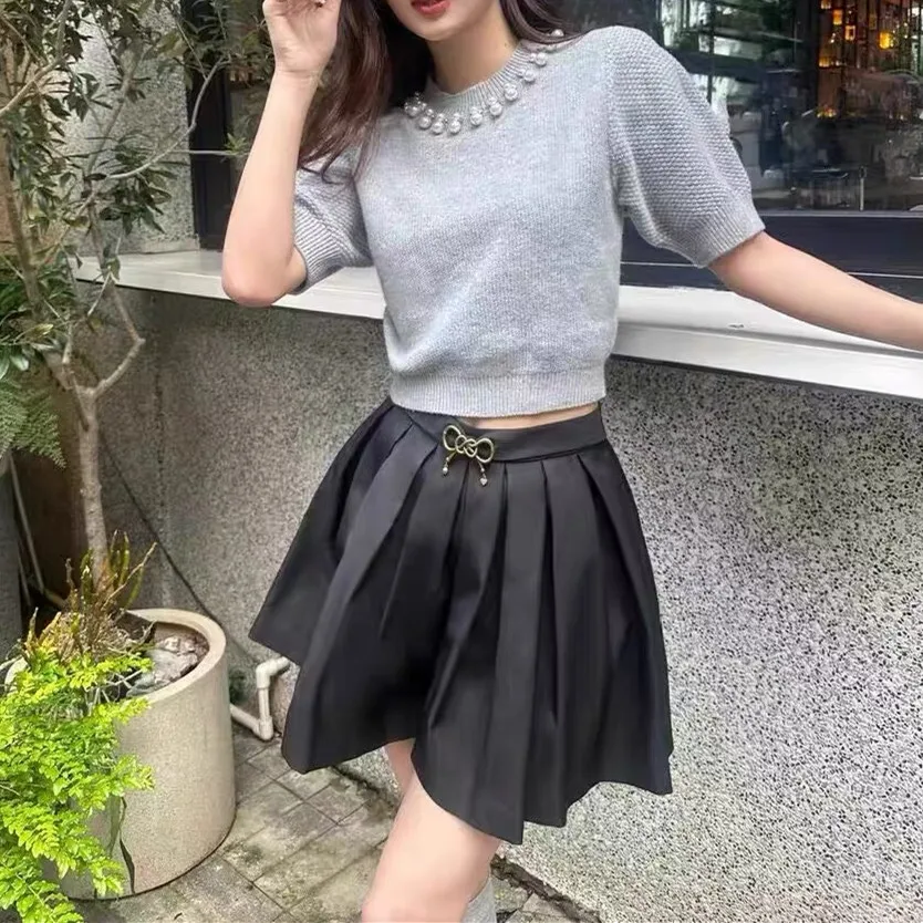 Ele Sweet Sle ort Sve Mujer de punto irt Retro Faion Versión de gama alta Top versátil redondo Ne ort Longitud