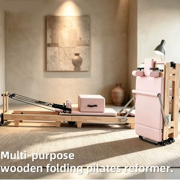 Competitive Price Foldable Solid Oak Pilates Reformer with Pink Upholstery & Durable Smooth Carriage for Home Gym Use
