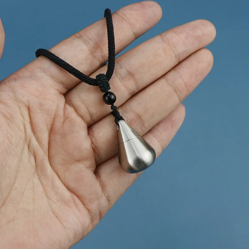 

Multifunctional Titanium/Stainless Steel Keychain Pendant - Waterproof Teardrop Pill Container, Emergency Medicine Case