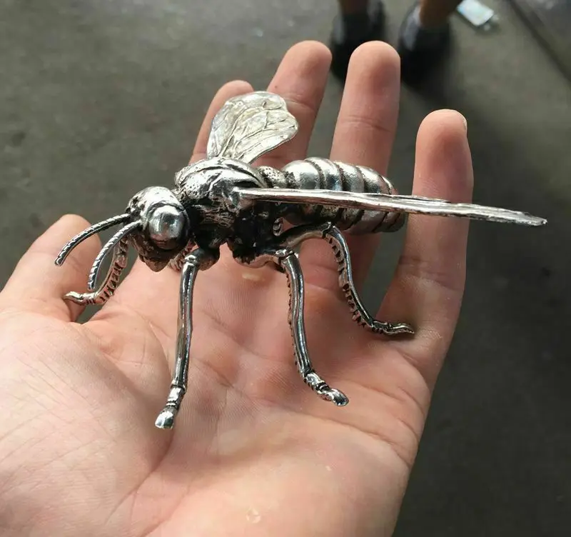 China Hand sculpture of the Miao silver statue, realistic dragonfly Ornament Statue