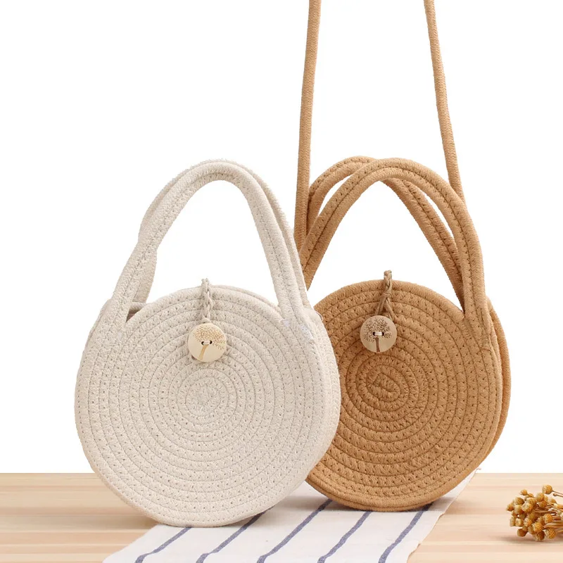 

New round cotton rope slung woven bag beach Bao Sen straw bag small round cake slung female bag.