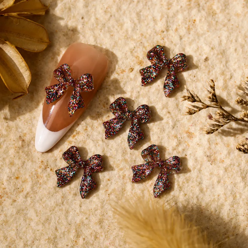 50 stücke Glitter Gemischte Farbe Bogen Nagel Charms 3D Kawaii Glänzende Pailletten Bögen Nagel Dekoration DIY Design Nagel Zubehör 11*12mm