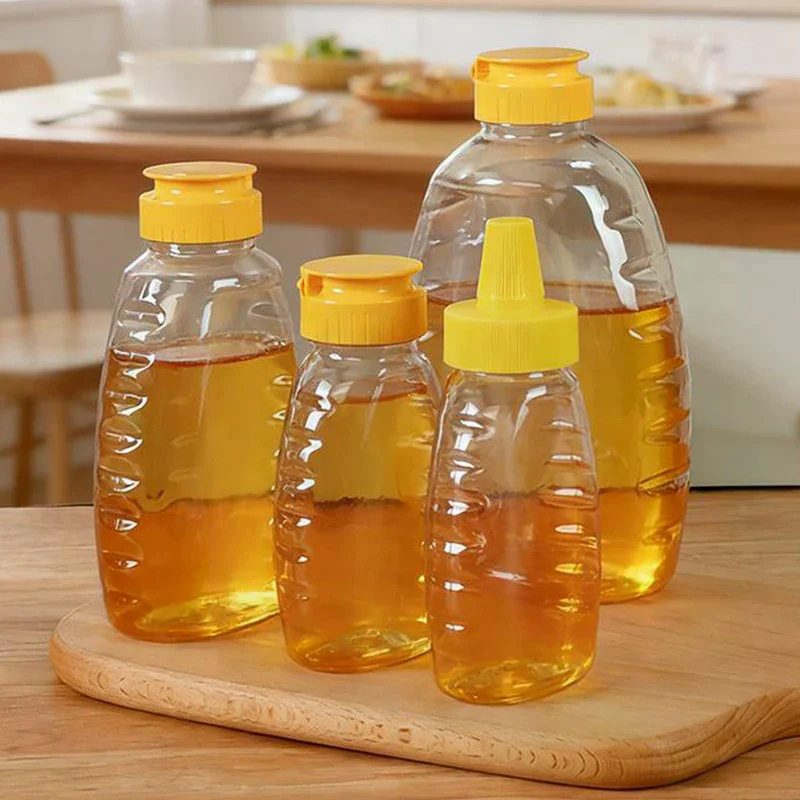 Reusable Plastic Honey Bottles Squeeze Honey Bottle Container Holder With Lid For Storing And Dispensing Honey Jar Transparent