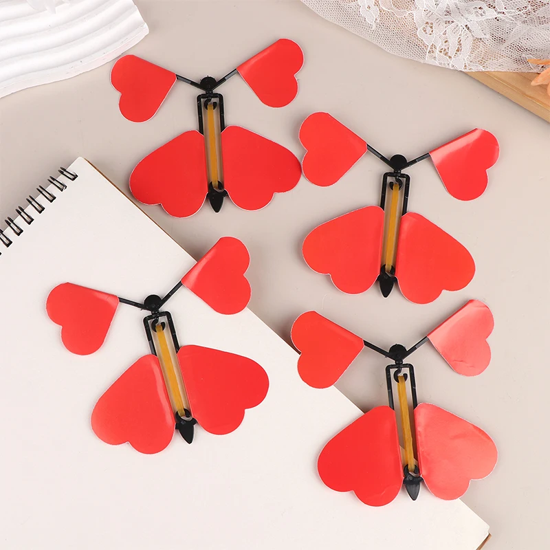 5/10/12 Uds. Juguete mágico de mariposa voladora, juguetes mágicos novedosos, banda de goma alimentada, trucos de magia de cuerda, juguetes, recuerdo de fiesta