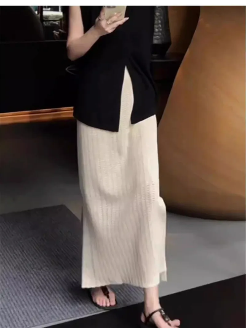 Gonna a trapezio scavata lavorata a maglia albicocca Donna 2025 Nuova primavera autunno Elastico in vita Spacco morbido Gonne temperamento versatile