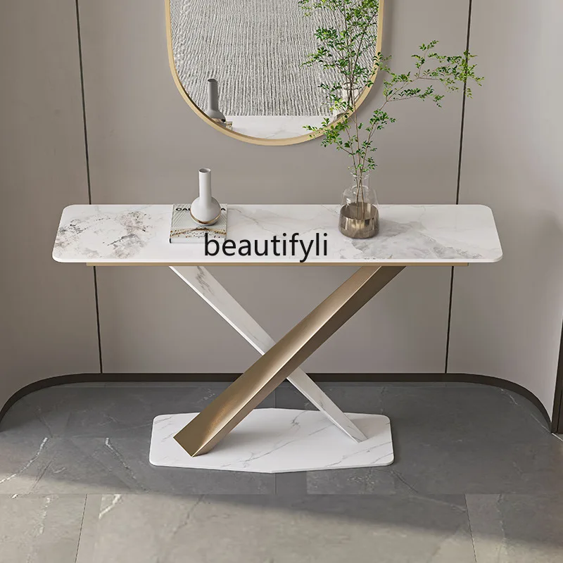 The rock slab entrance platform is minimalist, the entrance table is facing  door,   corridor is against the wall,