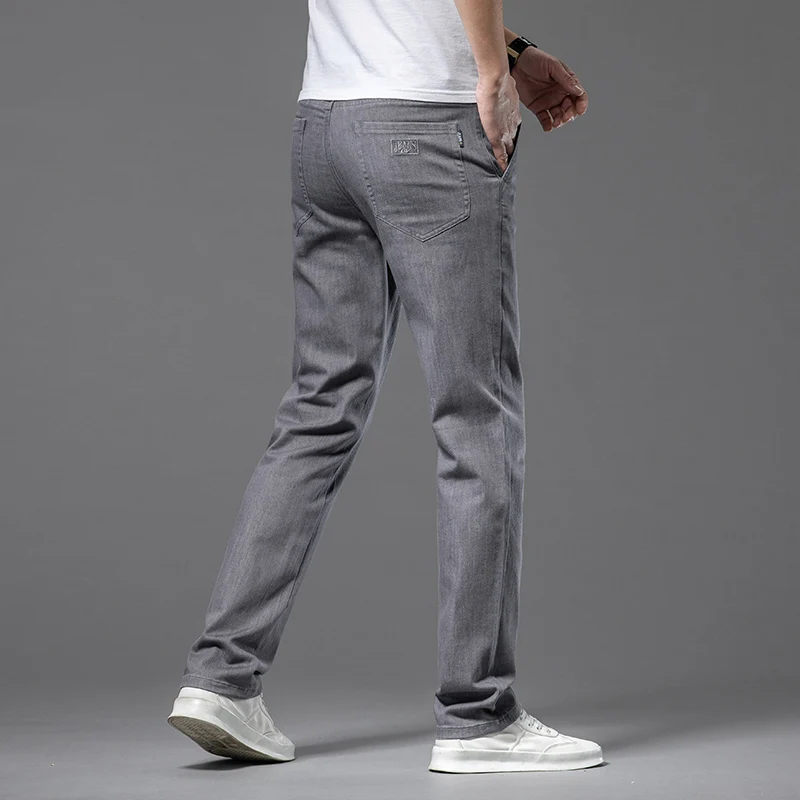 2023 primavera estate Denim sottile Jeans elasticizzati in cotone dritto uomo Business Casual panno a vita alta pantaloni leggeri in seta di ghiaccio