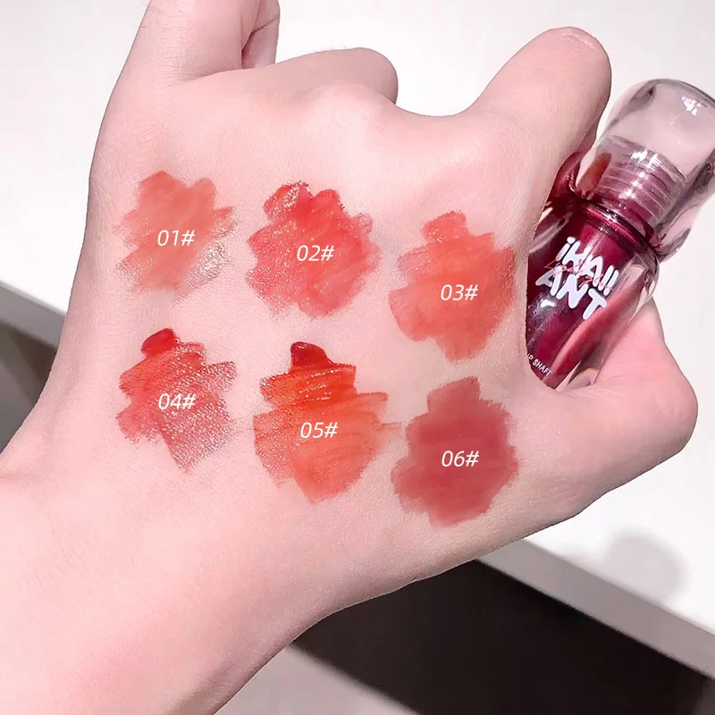 Crea colori bianchi con colori a specchio per labbra color olio, trucco umido, lucentezza trasmittata al ghiaccio, trucco labbra nella sensazione coreana di alta qualità, può abbinare con una varietà di trucchi. Adatto per la pelle gialla