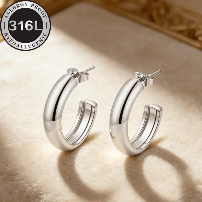 High quality stainless steel hypoallergenic golden earrings. Semicircular line horizontal goose egg. Anti-fading