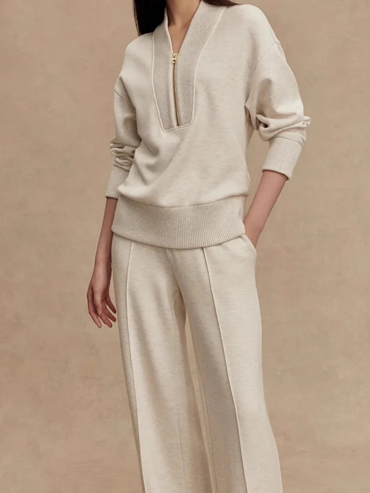 Elegante scollo a V con cerniera Top e pantaloni lunghi Set Tasca causale da donna Manica lunga Abito semplice Abbigliamento sportivo di moda Abiti da 2 pezzi lavorati a maglia