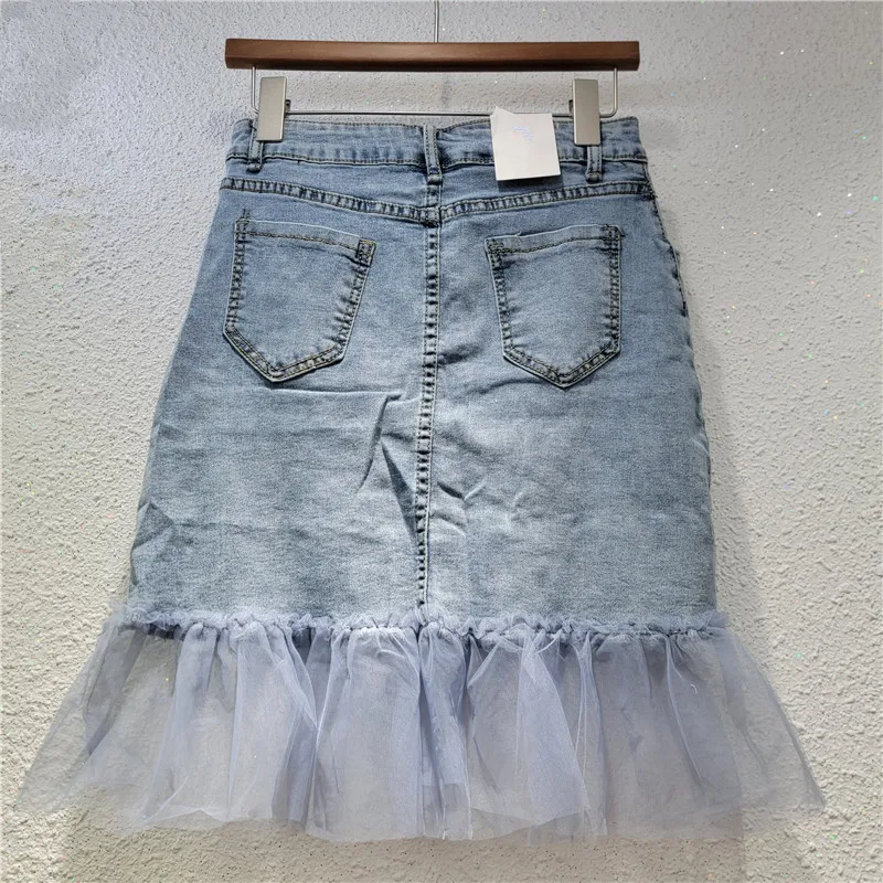 

Sheer Panel Skirt: Intricate embroidery & a vintage-inspired, distressed wash. Flattering and versatile for 2025.