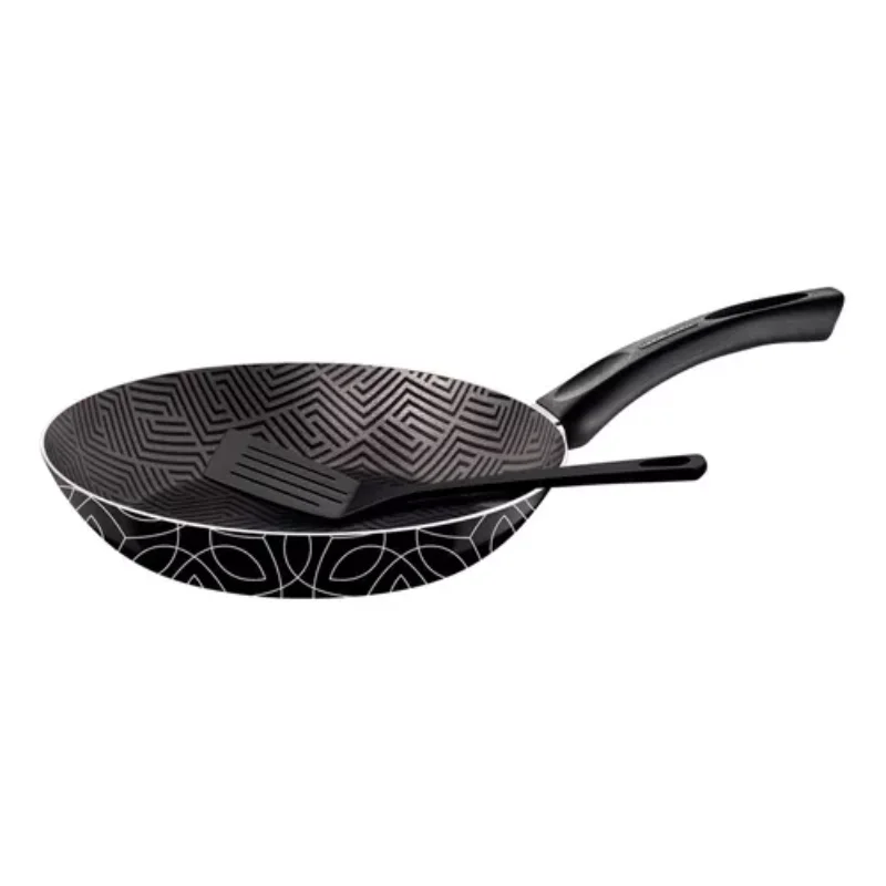 Aluminum curved Montina Paris pan with cooking spatula and baking battery, pot and pan