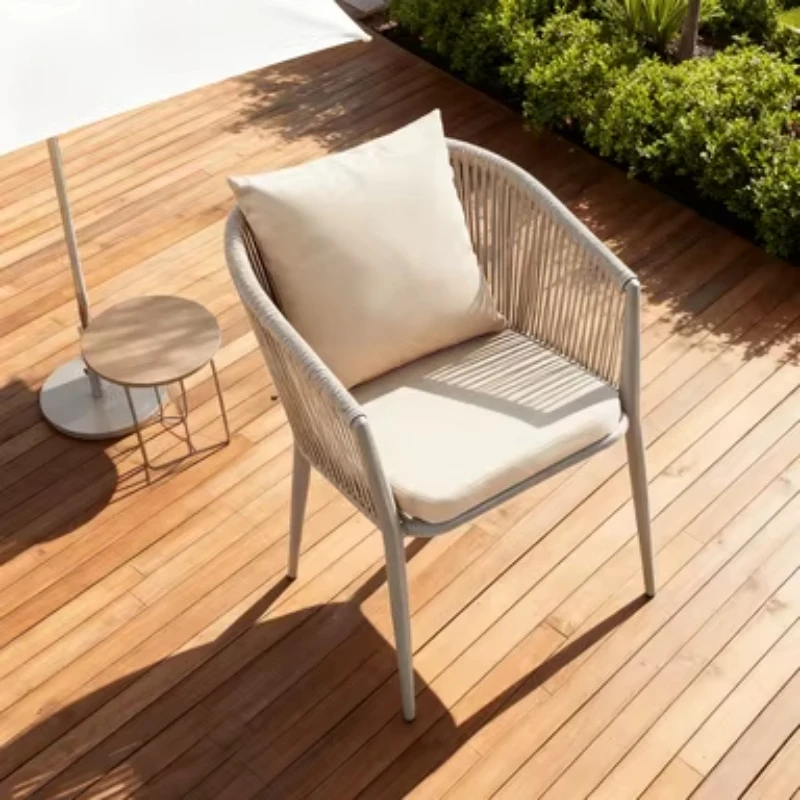 

Modern and durable outdoor dining chair with aluminum frame and round rattan seat, suitable for garden use