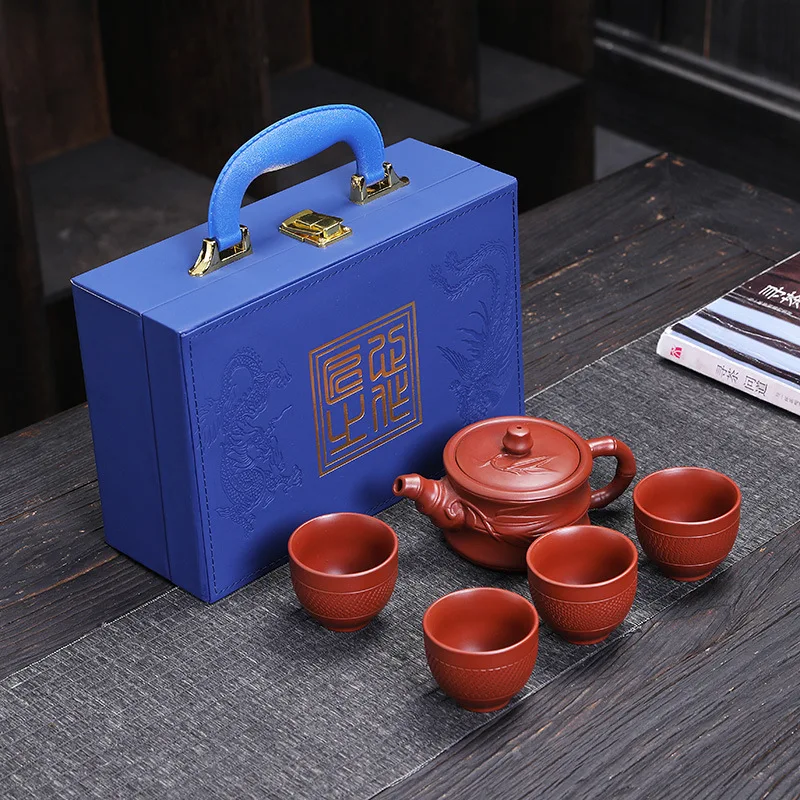 

Purple clay Tea Pot One Pot Four Cup Tea Cup Set Xishi Semi Handmade Household Living Room Kung Fu Tea pot