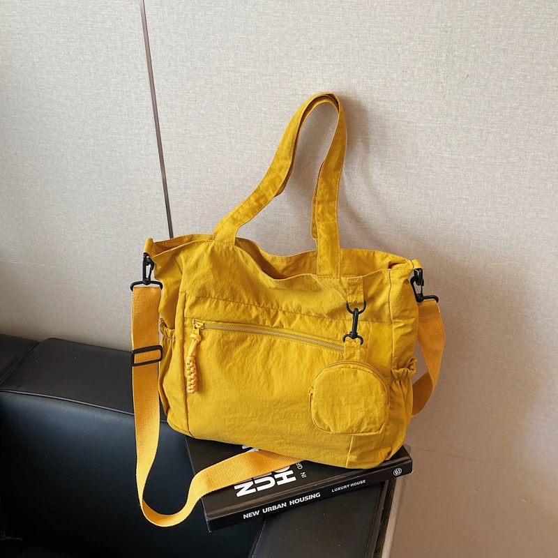 

2025 Hot Sale Versatile Interior Zipper Pocket Tote Bags Nylon Commuting Shoulder Bags Solid Color High Quality Ladies Bags