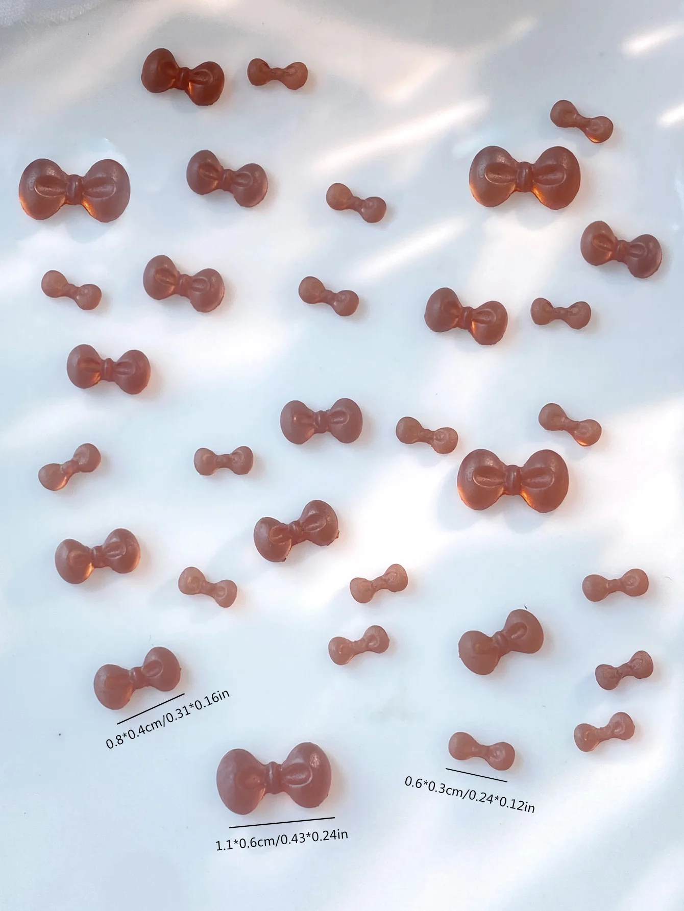 100 pièces mélange taille marron nœud papillon INS Nail Art breloques 3D Mini marron nœud papillon Style coréen accessoires pour ongles bricolage ongles