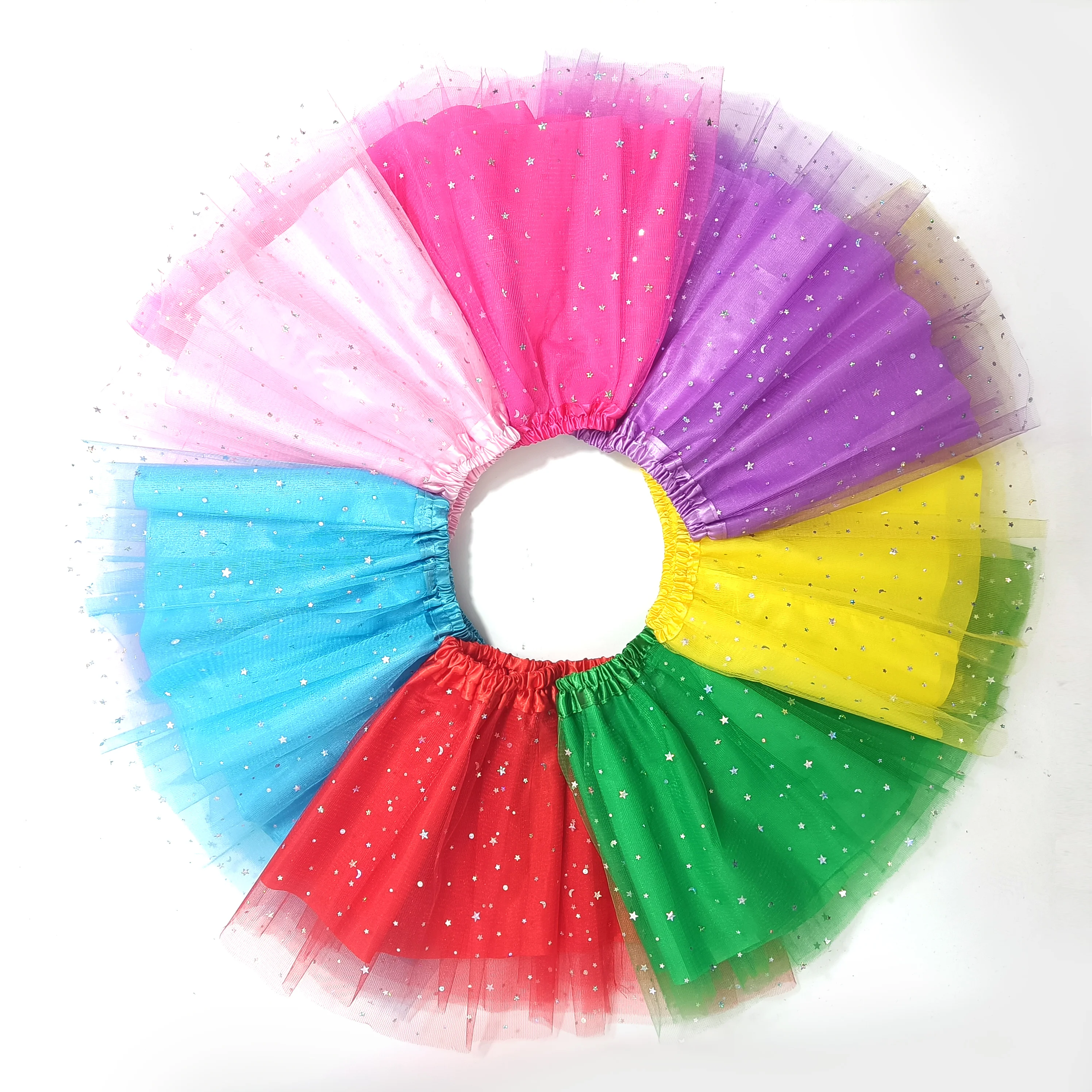 Adorned with Sparkling Star and Moon Patches, This Sweet Short Tutu Skirt Features Dreamy Candy-Hued Mesh.