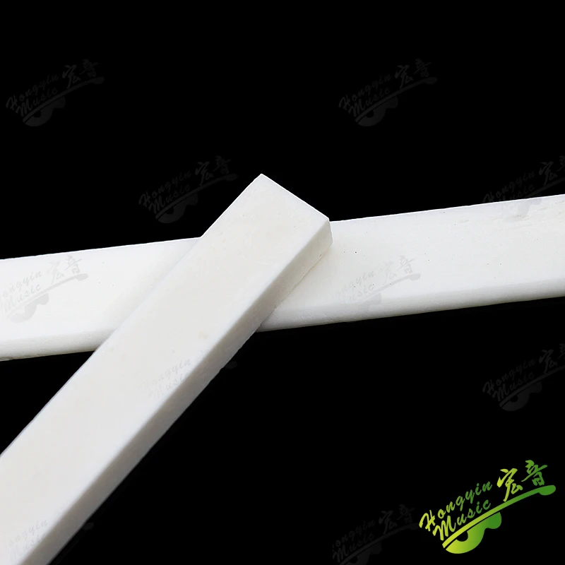 1 Stück Echter Knochensattel für Folk-, Akustik-, Klassische und Elektrische Gitarren 55mm/100mm Gitarrenzubehör – Detail 7