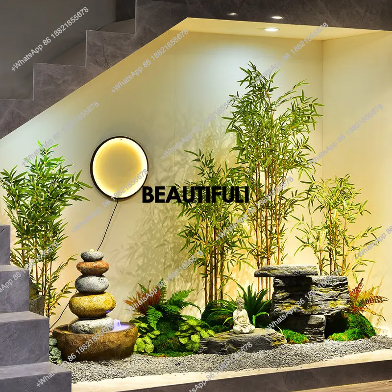 circulating water landscape, rockery stone landscaping under the stairs, simulated bamboo potted plants, image wall layout