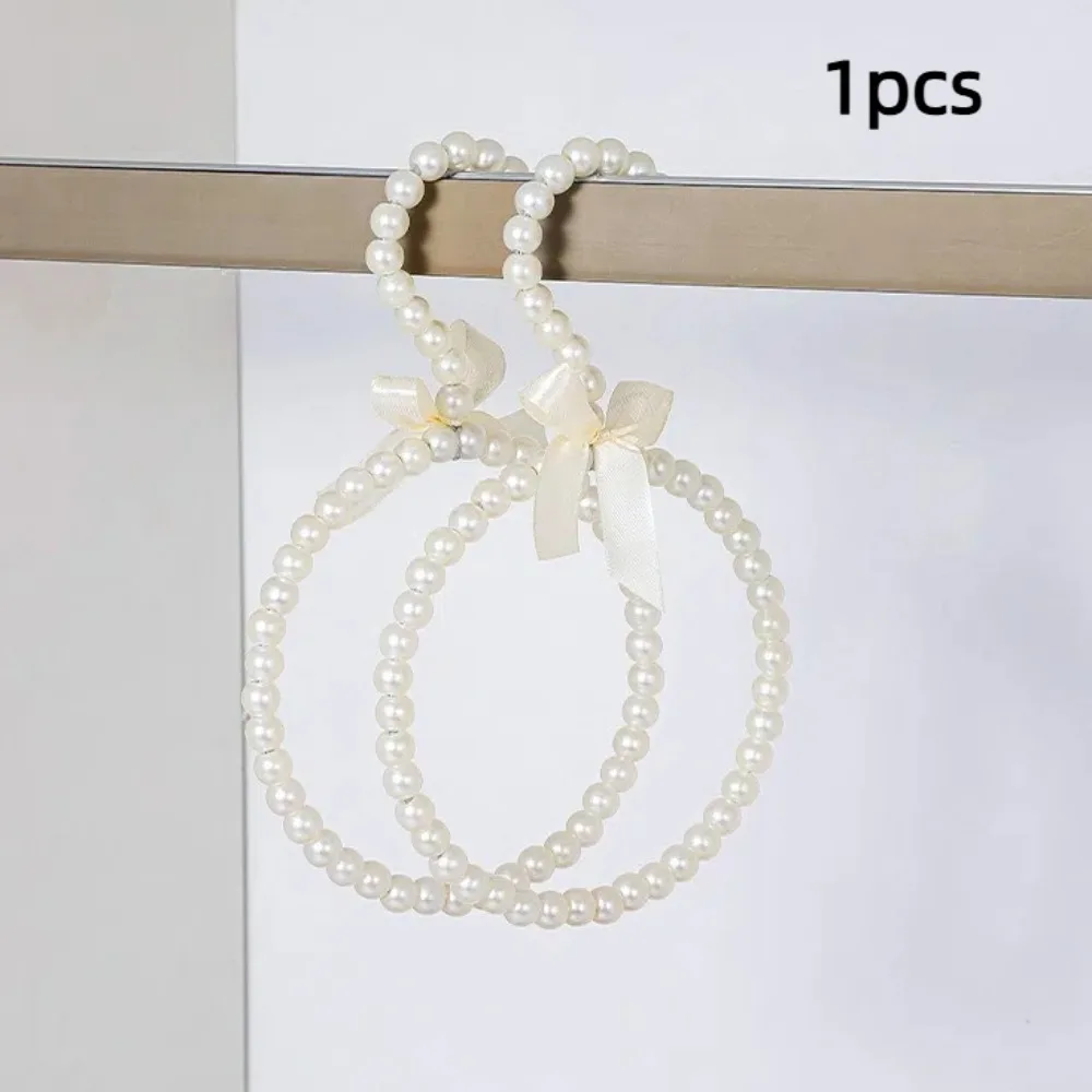 Perchero decorativo con cuentas de perlas de imitación, colgador de ropa con lazo, ahorro de espacio, forma redonda, colgador de vestido, bolsa de Color sólido, estante para cinturones para el hogar
