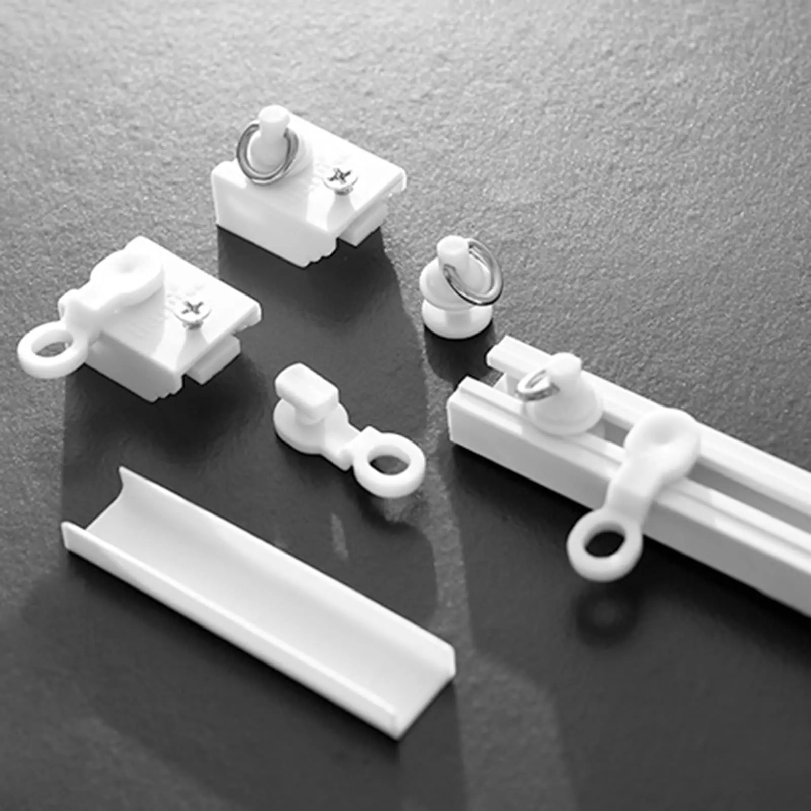 Accesorios autoadhesivos para pista de cortina