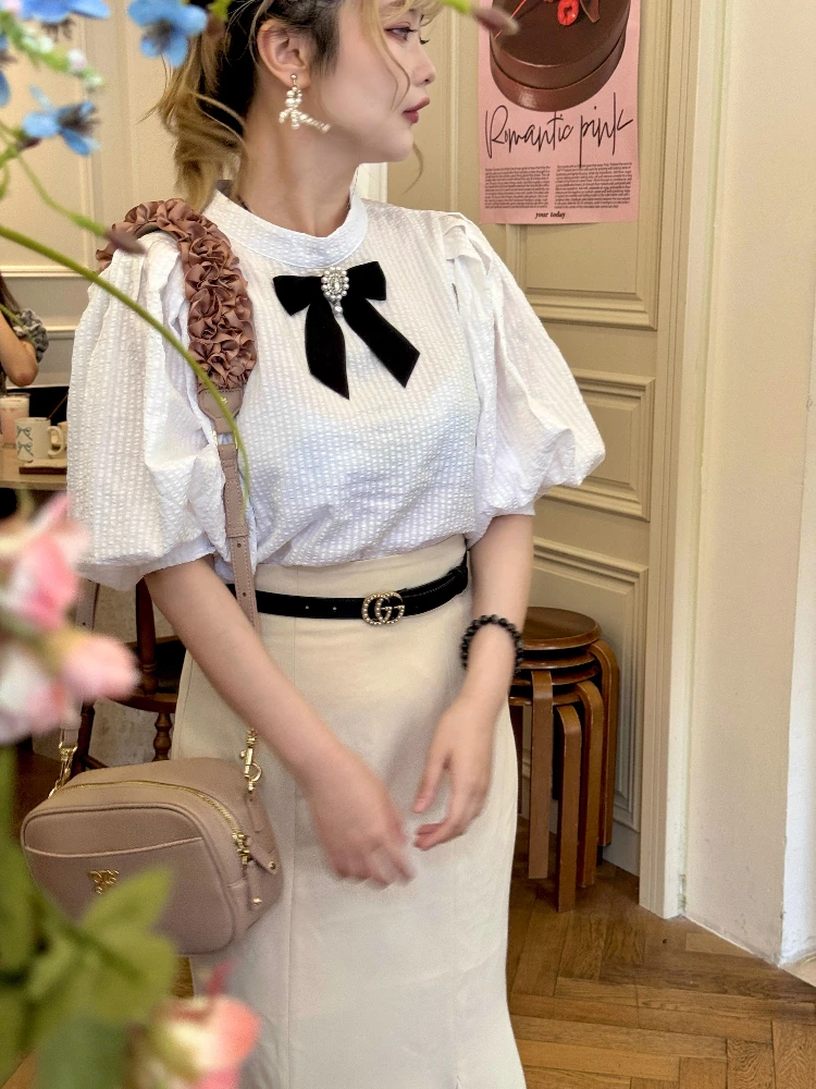Japanse stijl elegante zoete shirts ronde hals terug vetersluiting boog bubble mouw eenvoudige commuter veelzijdige blouse tops dames zomer