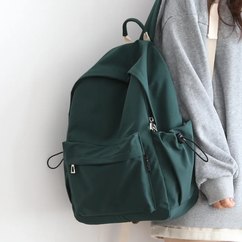 

2024 New All-in-one Simple Solid Color Backpack Female Fashion Casual Male Schoolbag Large Capacity Travel Bag Wholesale