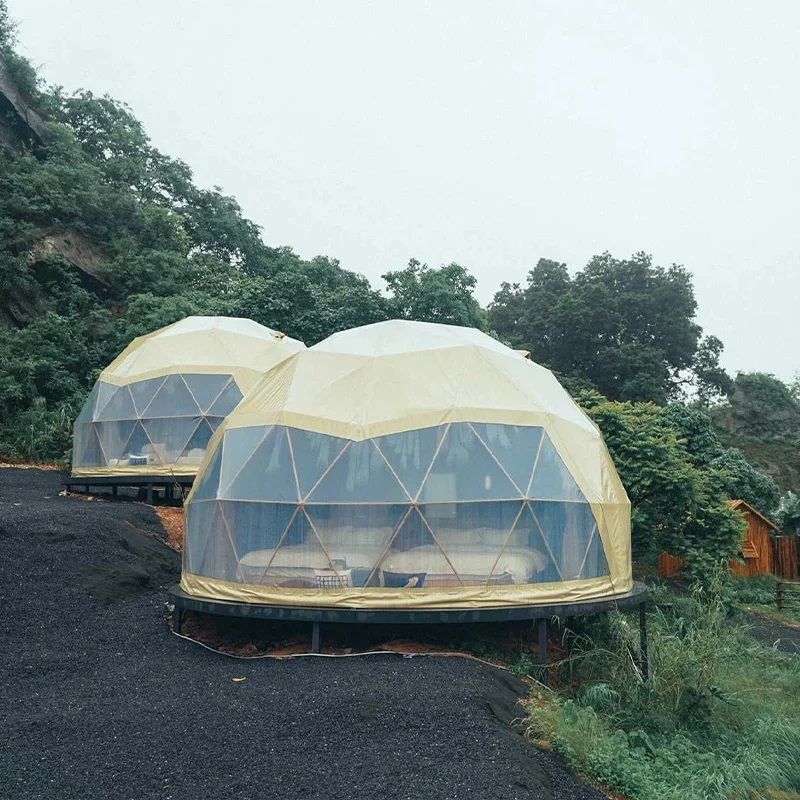 A luxury dome tent with a private bathroom and kitchenette, ideal for a hotel-style outdoor stay