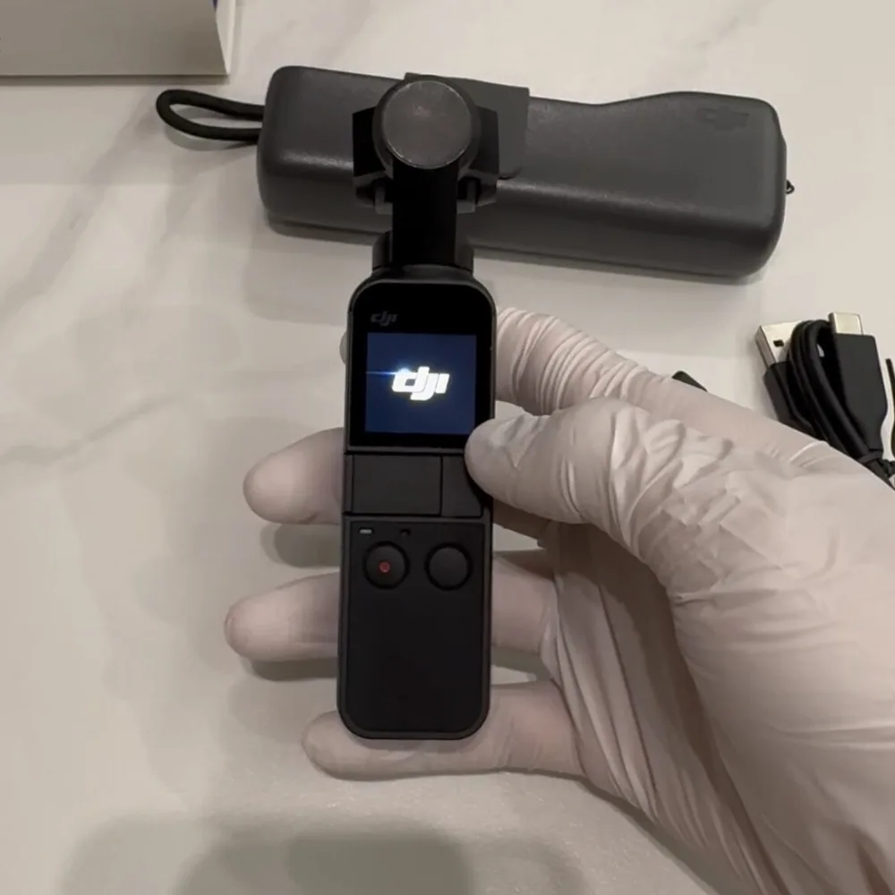 

Used DJI Osmo Pocket-Handheld 3-Axis Gimbal Stabilizer with integrated Camera
