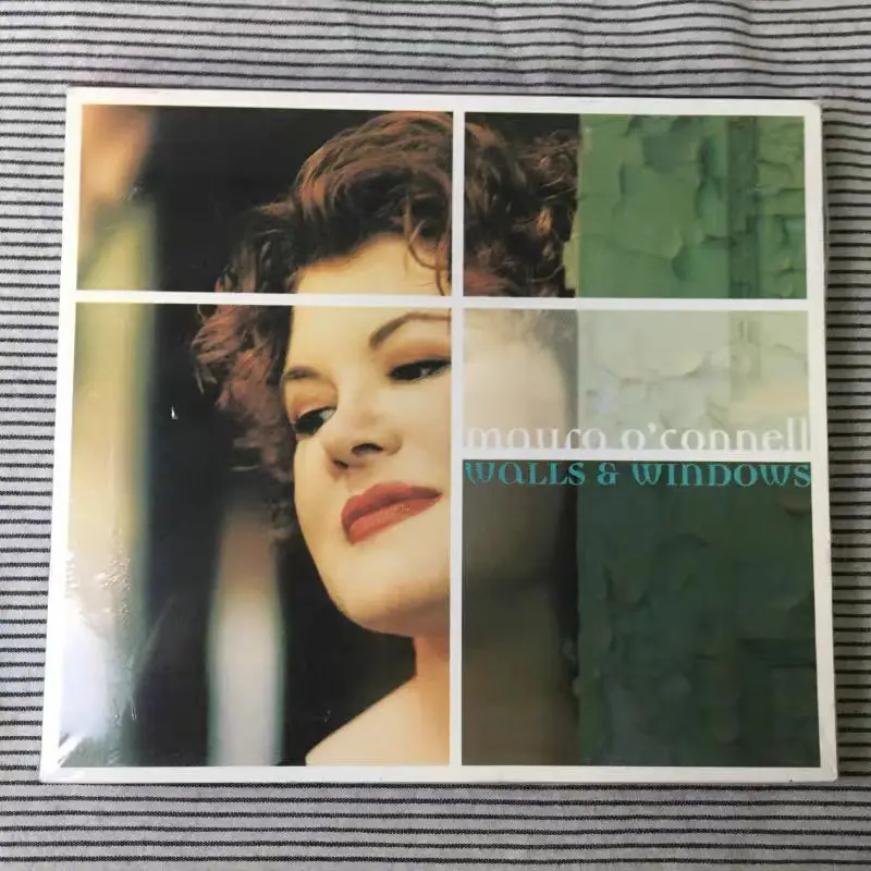 

CD November 13 2001 Irish Folk Diva Maura O'Connell Walls and Windows CD Captivates with Warm Vocals and Eclectic Musical Styles