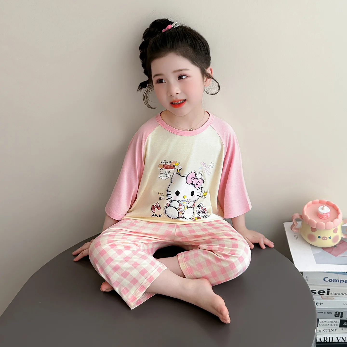 

Anime Hello Kitty girls' spring and summer casual pajamas cartoon short sleeved patchwork pleated pants children's home clothes