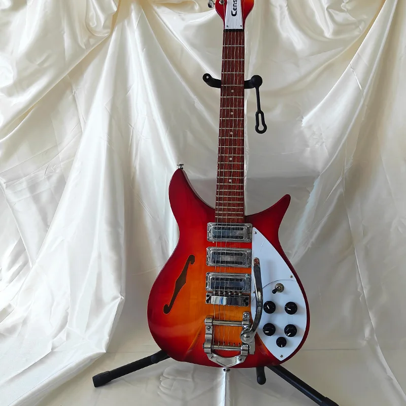 A trendy, eye-catching sunset red-orange electric guitar with a unique body shape that grabs attention on stage