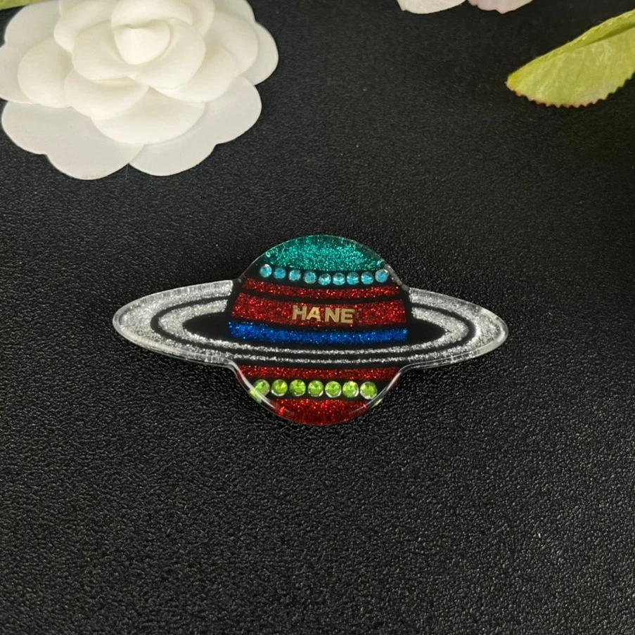 

Cosmic Earth acrylic brooch