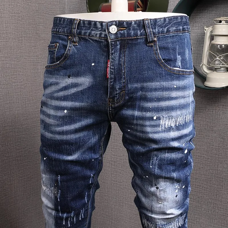 Moda urbana hombres Jeans Retro lavado azul estiramiento Slim Fit pintado rasgado Jeans hombres Vintage diseñador Denim pantalones Hombre