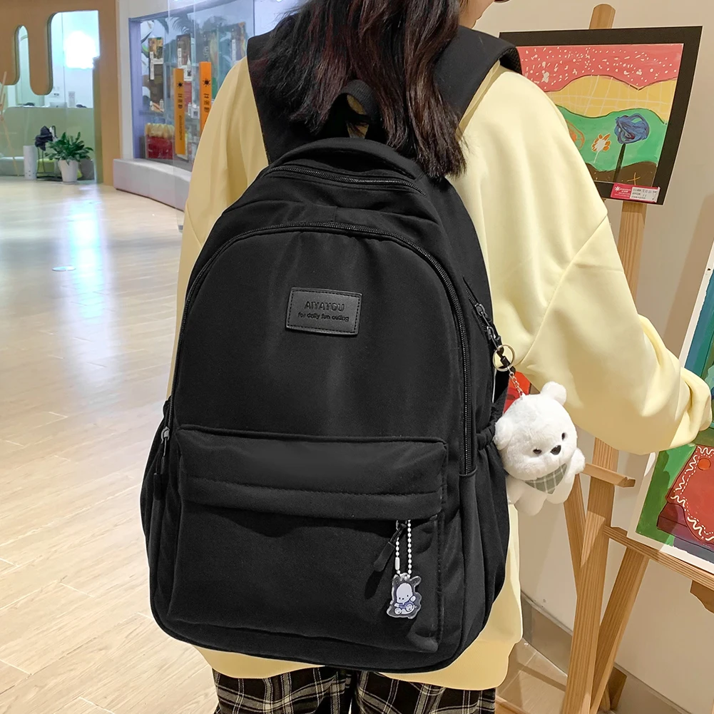 

Cool College Student Rucksack Large Capacity Travel Bookbags with Cute Pendant Simple Adjustable Strap Fashion for Outdoor Sport