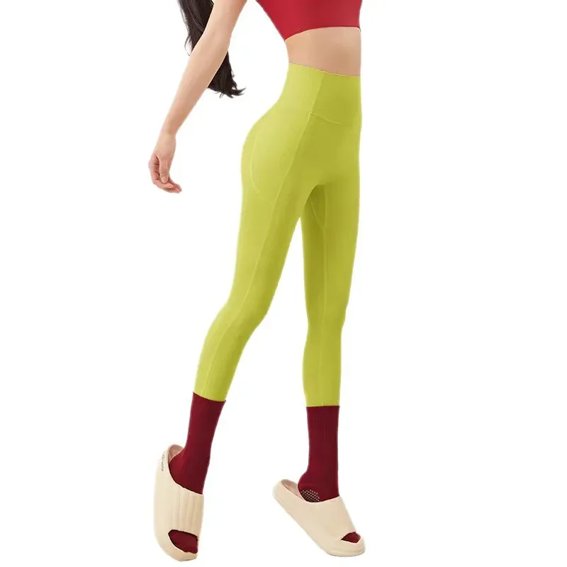 Naked fitness trousers women's smile line hip lift sports leggings women's outdoor high waist seamless nine-point yoga pants
