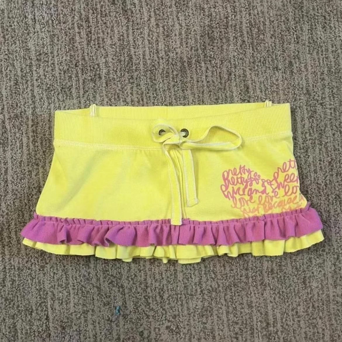 Women Y2K Low‑Waist Micro Sweat Skirt Yellow Purple Color Block Ruffle Hem Letter Print Drawstring Waist Cute Kawaii MoniBottoms