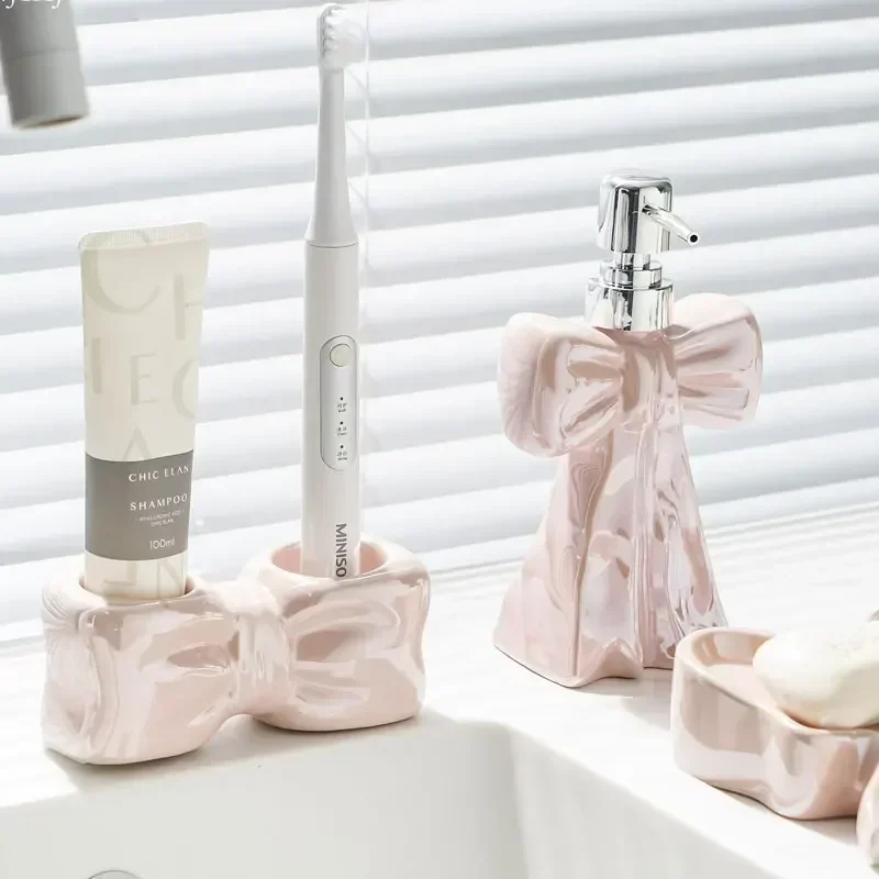 Creative bow lotion bottle electric toothbrush toothbrush rack toothpaste shelf toilet wash basin storage base cup dispenser