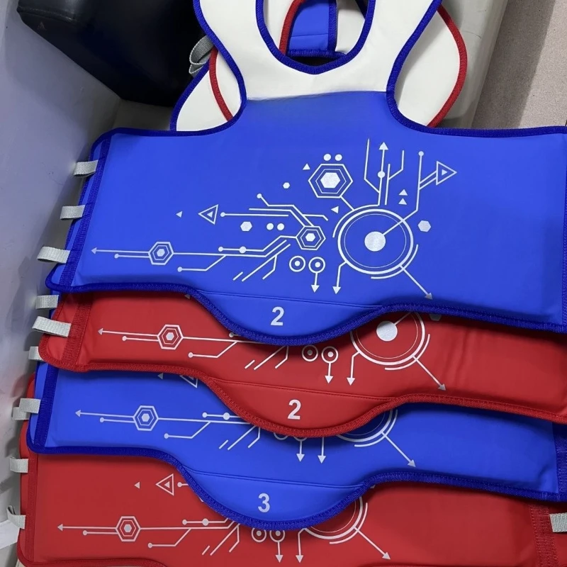 

Electronic protective gear, two pieces in red and blue.