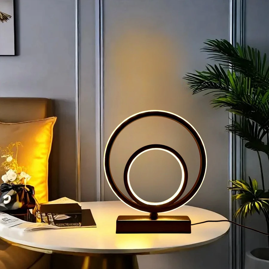 Modern and Minimalist Ring-Shaped Desktop and Bedside Lamp. It Is Powered by USB and Has the Function of Three-Color Dimming.