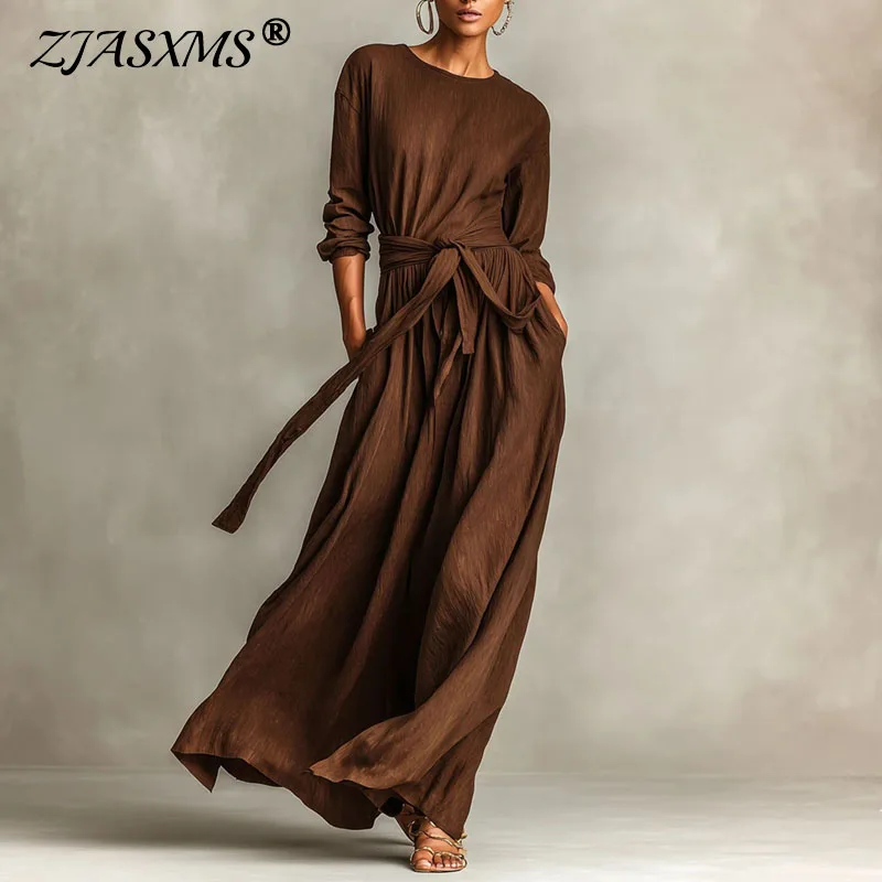 เดรสยาวลำลองสไตล์โบฮีเมียน แขนยาว คอทรงโอ มีกระเป๋า เอวสูง ผูกโบว์  สำหรับผู้หญิง  ใส่ได้ทั้งฤดูใบไม้ผลิและฤดูใบไม้ร่วง  ดีไซน์เรียบหรู